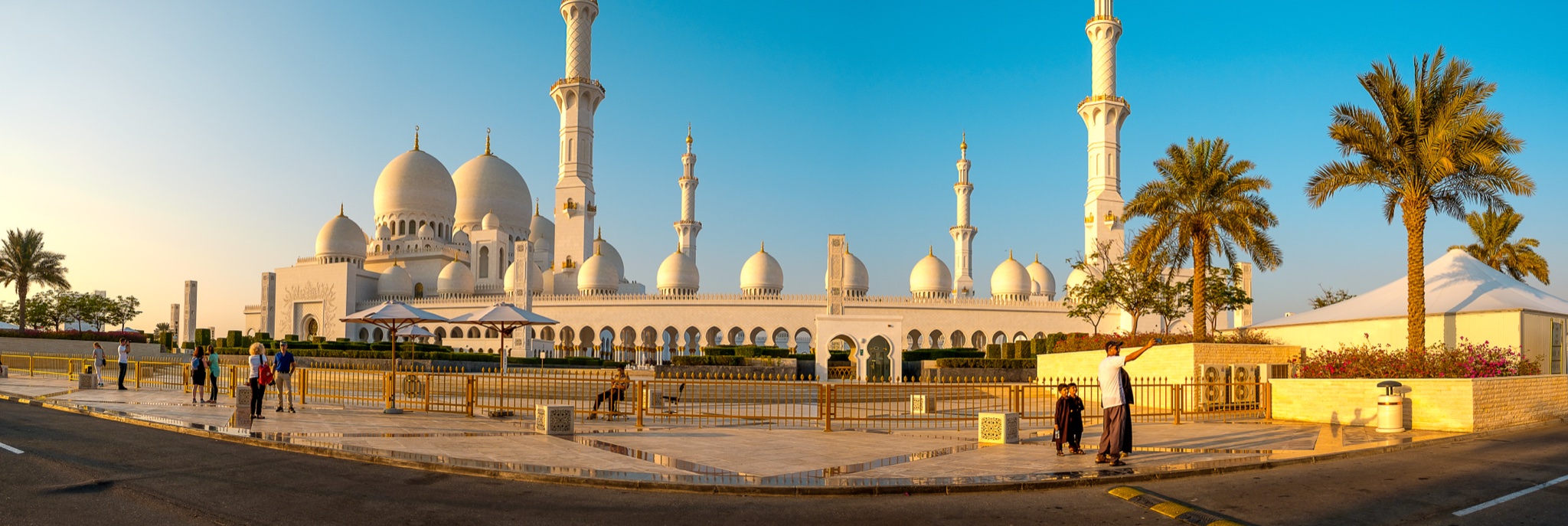 A mosque and minarets in warm evening light
